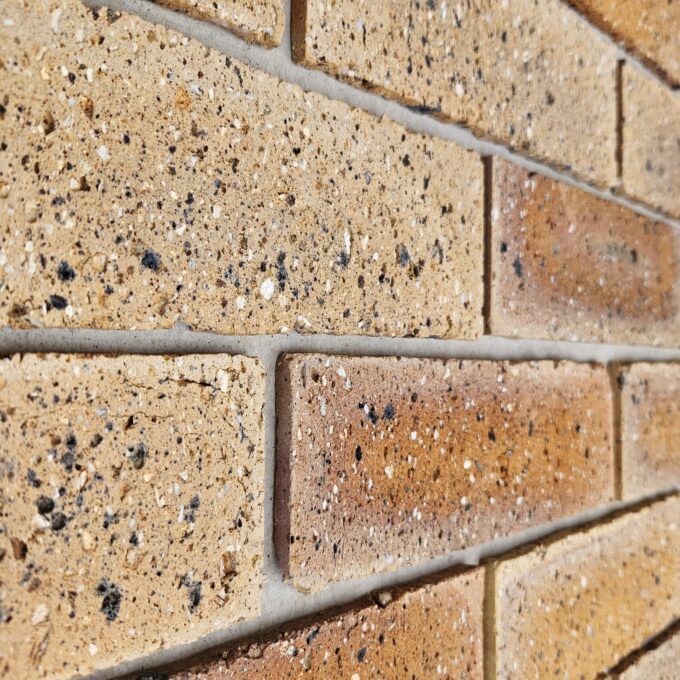 Radiant Gold Brick Tile cladding installation